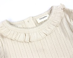 Lil Atelier sheer bliss flæse top